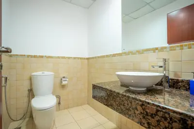 a bathroom with a sink and a toilet at RH- Walk to JBR beach & Tram, Comfortable 02BR in Dubai