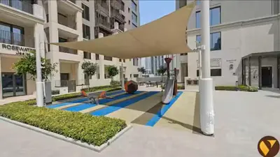 a view of a courtyard of a building at Vogue Creek Harbour Breeze Creek Beach Waterfront Living Close to Downtown, Burj Khalifa and Dubai Mall, Two Bedroom apartment With Balcony and Private Manmade Beach, Access to all Amenities in Dubai