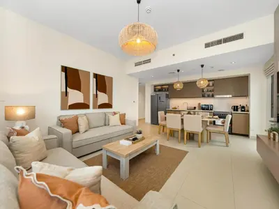 a living room with a couch and a table at Sky High 2-Bedroom Apartment Stunning Opera & Downtown Views Opp Dubai Mall in Dubai