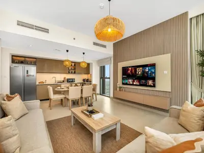 a living room with a couch and a table at Sky High 2-Bedroom Apartment Stunning Opera & Downtown Views Opp Dubai Mall in Dubai