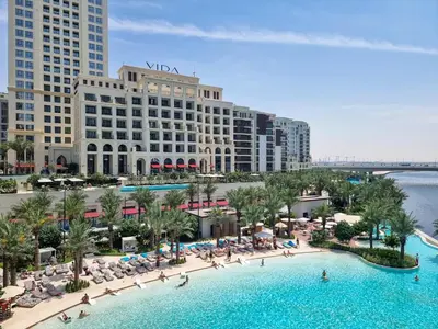 an aerial view of a resort with a large swimming pool at Vida Voyage - Vida Residences - Creek Harbour in Dubai