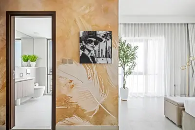 a living room with a painting on the wall at Vida Voyage - Vida Residences - Creek Harbour in Dubai