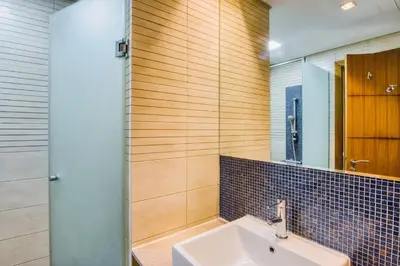 a bathroom with a sink and a mirror at Luxurious 2BR in The Palm Jumeirah in Dubai