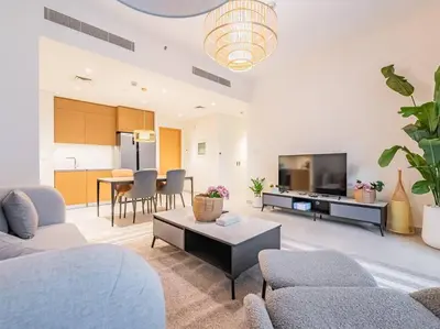 a living room with a couch and a table at Ravishing Retreat 2BR Creek Beach Luxury Abode in Dubai