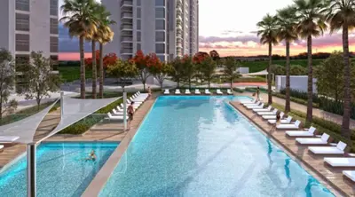 an image of a swimming pool with lounge chairs and palm trees at Nasma Luxury Stays - Charming Studio at DAMAC Hills Artesia Tower C in Dubai