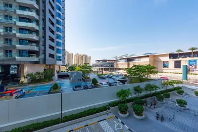 an overhead view of a parking lot in a city at Chic Palm Studio with Infinity Pool in Dubai