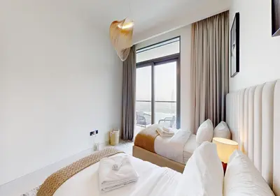 a hotel room with two beds and a window at Waterfront ,High Floor 2BED with Private Beach Access in Dubai