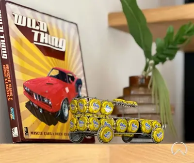 a toy truck on a table next to a box of used things at Oraya - Collective 2 0 Tower A Sanctuary in Dubai Hills in Dubai