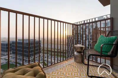 a balcony with a chair and a view of a city at Oraya - Collective 2 0 Tower A Sanctuary in Dubai Hills in Dubai