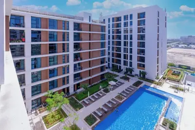 an aerial view of a building with a swimming pool at Park Point C-1 bedroom for monthly stay-1003 in Dubai