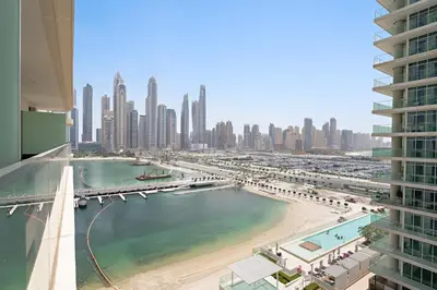 a view of a city with a beach and buildings at Silkhaus Sea & Palm View 1BDR in Marina Vista in Dubai