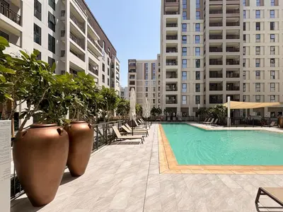 a swimming pool in the middle of a building at Frank Porter - Bayshore at Creek Beach in Dubai