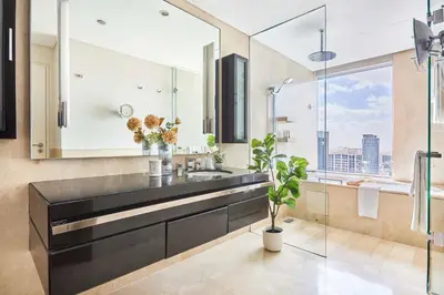 a bathroom with a sink and a large window at Frank Porter - Emaar Residences Dubai Marina in Dubai