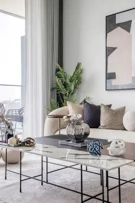 a living room with a couch and a coffee table at 2BR Beachfront Gem with Dazzling Views of the Palm in Dubai