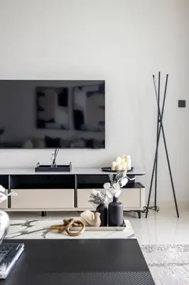 a living room with a flat screen tv at 2BR Beachfront Gem with Dazzling Views of the Palm in Dubai
