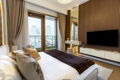 a bedroom with a large bed and a large window at Dubaiashome - Luxury Special Stay in Dubai
