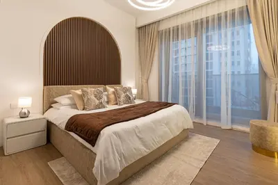 a bedroom with a large bed and a large window at Dubaiashome - Luxury Special Stay in Dubai