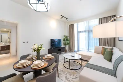 a living room with a couch and a table at Marco Polo - Modern 1BR in Business Bay near Burj Khalifa in Dubai