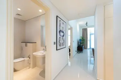 a bathroom with a white toilet and a sink and a toilet istg at Marco Polo - Modern 1BR in Business Bay near Burj Khalifa in Dubai