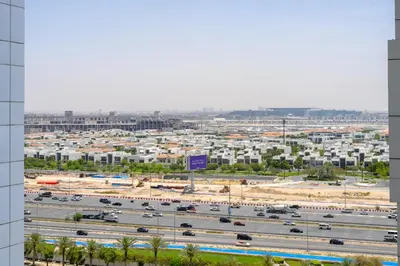 a view of a parking lot and a freeway at Marco Polo - Modern 1BR in Business Bay near Burj Khalifa in Dubai