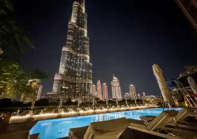 a view of a tall building at night at Address Dubai Opera Residences in Dubai