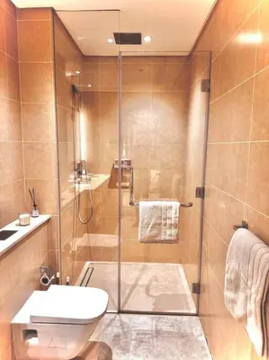 a bathroom with a shower and a toilet at Dubai Marina Gate 1 Deluxe in Dubai