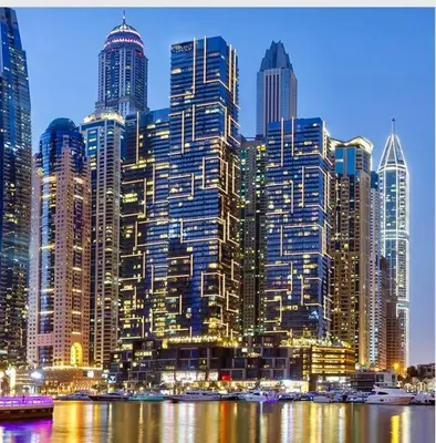 a large city skyline with tall buildings and water at Dubai Marina Gate 1 Deluxe in Dubai