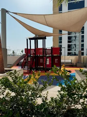 a playground in the middle of a building at VESTA - Dubai Residence in Dubai
