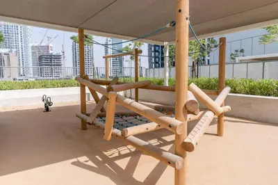 a swing on the roof of a building at GuestReady - Modern living at Reva Residence in Dubai
