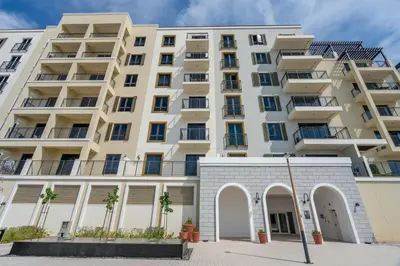 an apartment building with arches in front of it at GuestReady - Luxurious living with sea view in Dubai