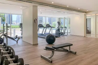 a gym with several treadmills and exercise machines at Glamorous 1Bedroom in Business bay l Large Balcony in Dubai