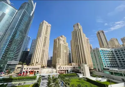 a group of tall buildings in a city at Luxe 1BD apartment in La Vie with beach access in Dubai
