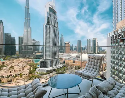 a view of a city skyline from a balcony at Stunning 2BR Full Burj Khalifa Views 5min walk to Dubai Mall in Dubai