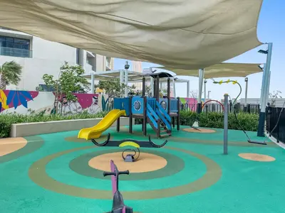 a playground with a slide and a play structure at Silkhaus New High Floor Studio In Business Bay in Dubai