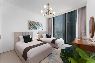 a bedroom with two beds and a large window at Maison Privee - Luxury Living w/ Superb Sea Views in Address JBR in Dubai