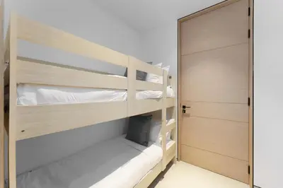 a room with two bunk beds and a closet at Maison Privee - Luxury Living w/ Superb Sea Views in Address JBR in Dubai