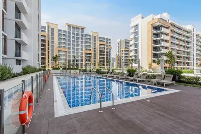 an image of a swimming pool at a apartment complex at Lux Stu Bright Urban Escape Stay Near Downtown in Dubai