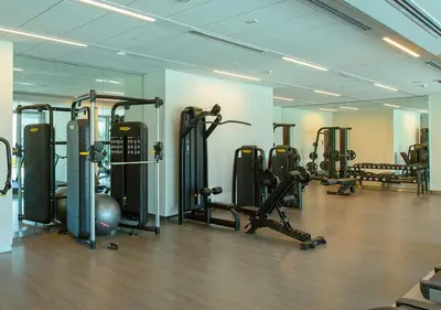 a gym with several treadmills and exercise bikes at Downtown Views 4702 in Dubai