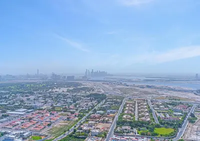 an aerial view of a city with buildings and the ocean at Downtown Views 4702 in Dubai
