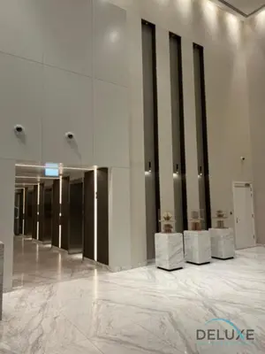 a lobby with white furniture in a building at Luxurious 2BR Apartment at Boulevard Point Downtown Dubai by Deluxe Holiday Homes in Dubai