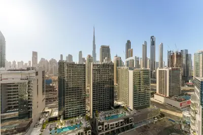 an aerial view of a city with tall buildings at Contemporary Apartment with Burj Khalifa View in Dubai