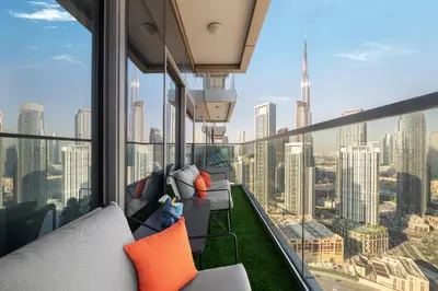 an apartment balcony with a view of the city at Best Burj Khalifa View Balcony Apartment with 64th-Floor Infinity Pool in Paramount Hotel Midtown in Dubai