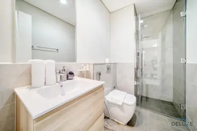 a bathroom with a sink and a shower at Peaceful 1BR at Golf Vita A Damac Hills by Deluxe Holiday Homes in Dubai