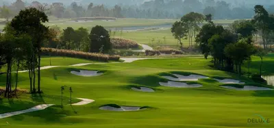 a view of a golf course with a green at Peaceful 1BR at Golf Vita A Damac Hills by Deluxe Holiday Homes in Dubai