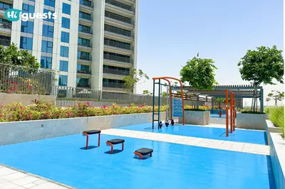 a playground in the middle of a pool at HiGuests - Sky-High Luxury 2BR Apt in Downtown Views Dubai in Dubai