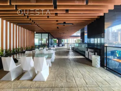 a lobby of a building with a table and chairs at Bayz Tower, Business Bay in Dubai