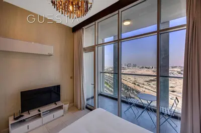 a bedroom with a bed and a large window at Bayz Tower, Business Bay in Dubai