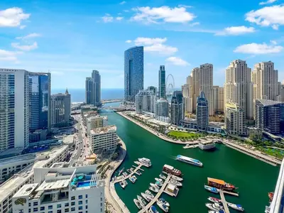 an aerial view of a city with a harbor at FAM Living - Stunning Modern Marina Apartment in Dubai