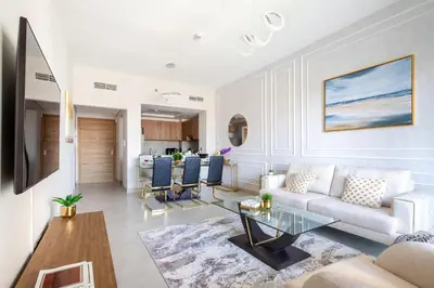 a living room with a couch and a table at Frank Porter - Eleganz 5 in Dubai