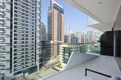 a view of a city from the balcony of a building at Deluxe 1BR Corner Suite with Marina Views in Dubai